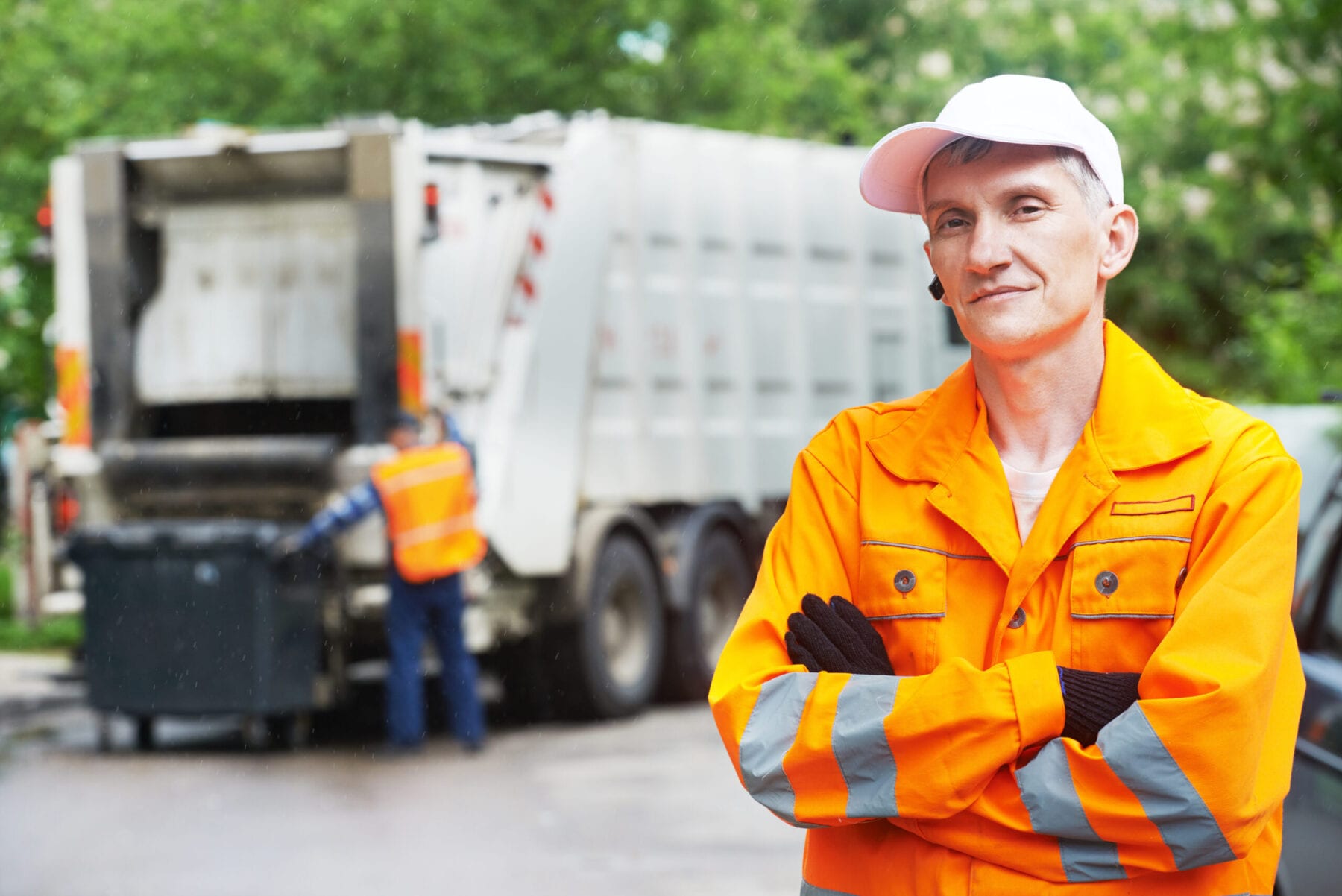 Recycling waste and garbage Portrait of municipal worker recycling garbage collector truck loading waste and trash bin